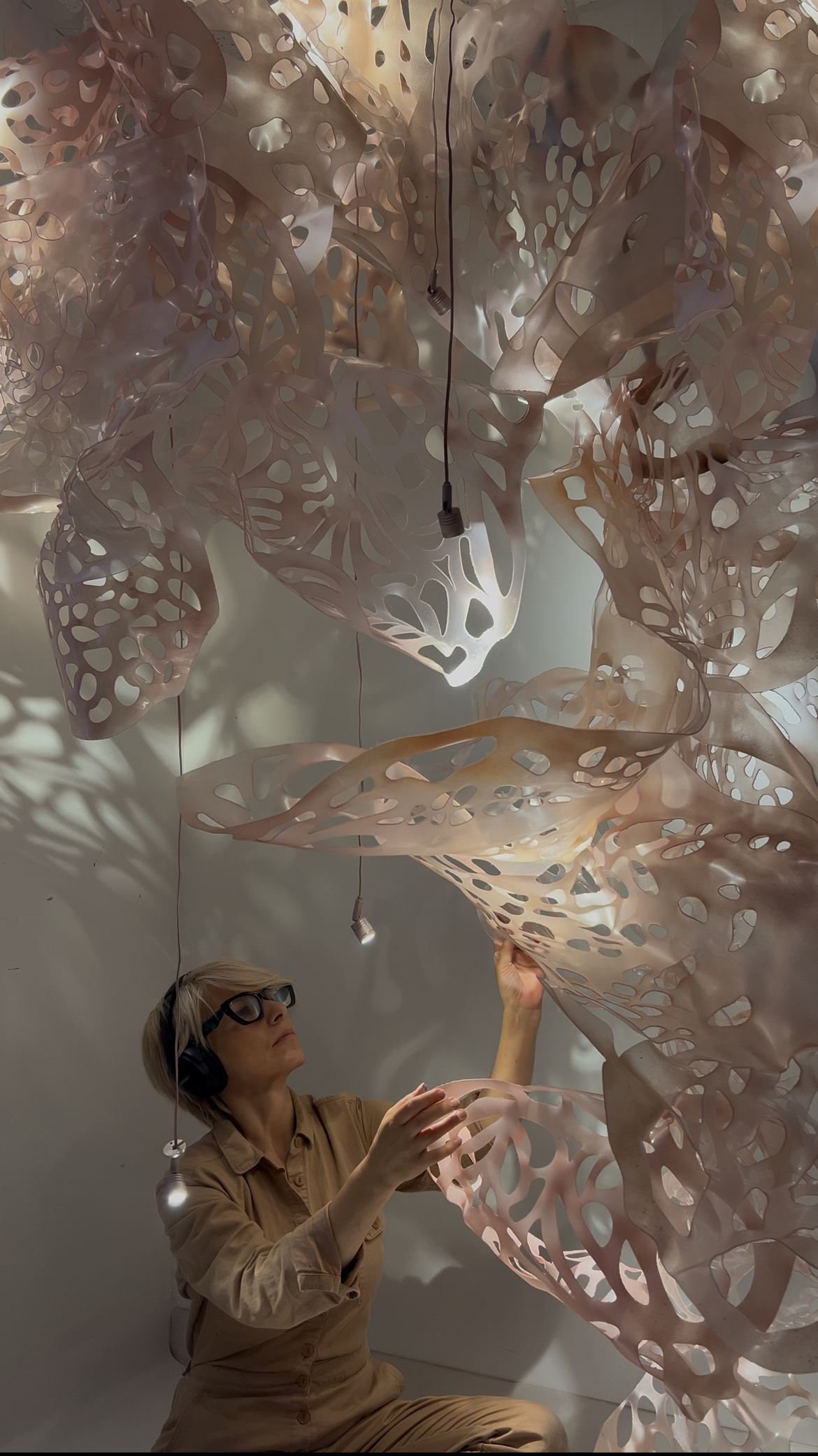 artist touches scultural work